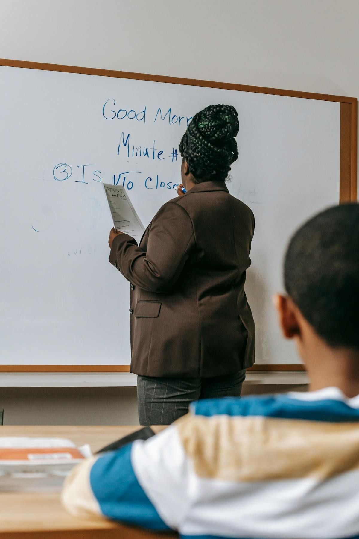 Institution manager reviewing accreditation documents